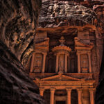 Petra Treasury revealed through the Siq canyon in Petra Jordan