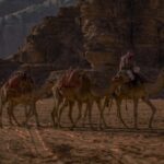 Camel caravan crossing the desert at Wadi Rum, Jordan