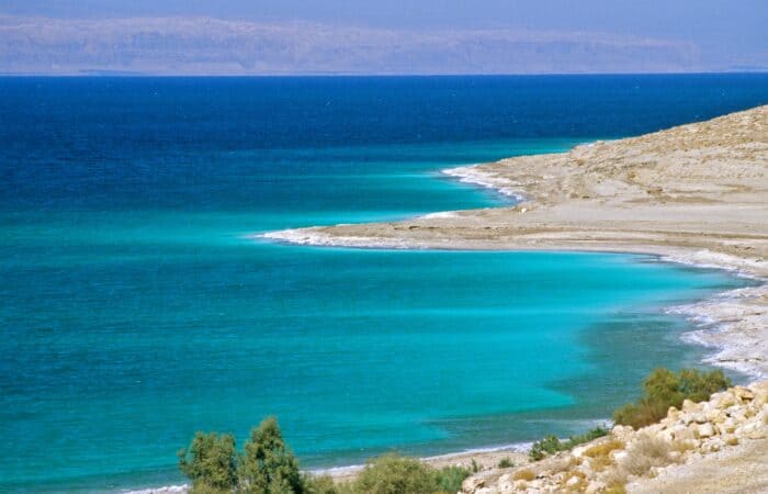 Turquoise Dead Sea water and mineral shoreline in Jordan