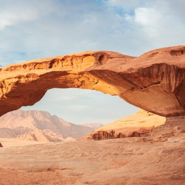 Natural sandstone rock arch in Wadi Rum, Jordan