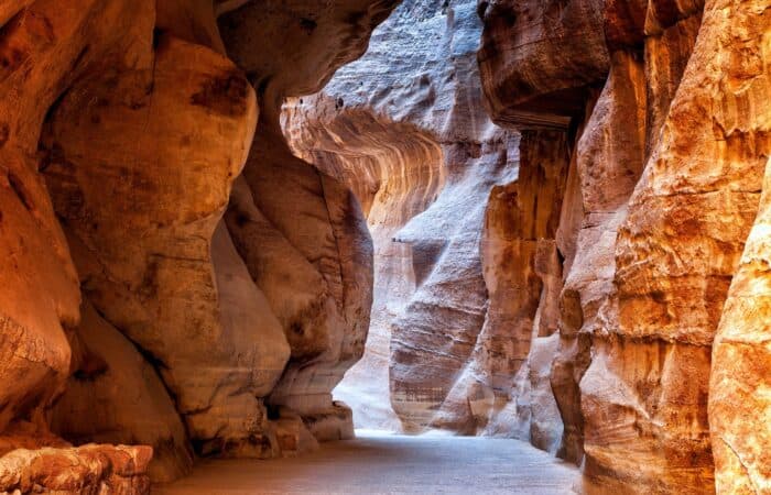 The narrow sandstone Siq passage leading into Petra, Jordan